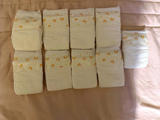 Baby Doll Disposable Diapers, 9 Count, White Rainbow, and froggy wipe dispenser