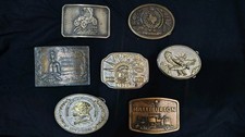 7 Vintage Assortment Of Belt Buckles.