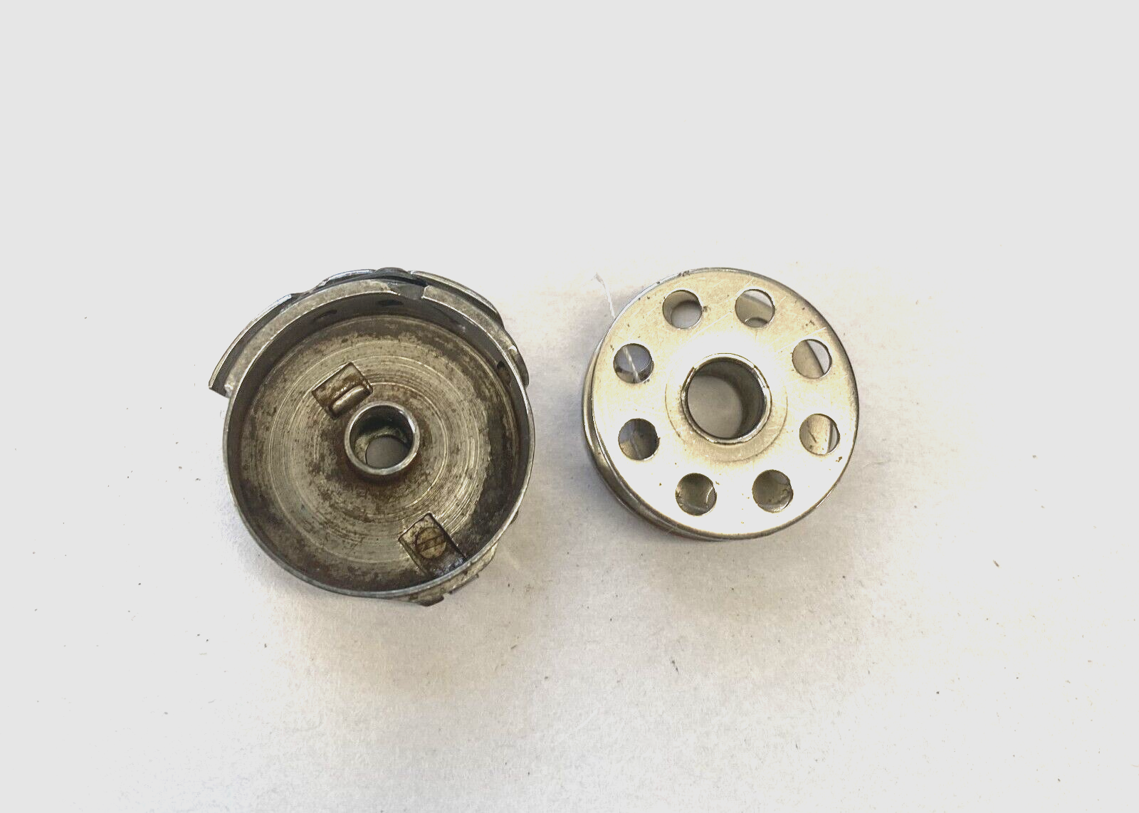 A Vintage Bobbin Case w/ Bobbin from a Model 221 Featherweight Machine