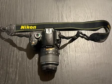 Nikon D60 DSLR Camera w/ AF-S DX 18–55mm VR Lens & Strap