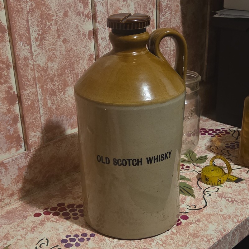 antique old scotch whiskey jug with screw on court very very nice