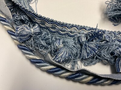 3/8'' VARIEGATED BLUE CORD WITH LIP AND TASSEL FRINGE.  CONSO