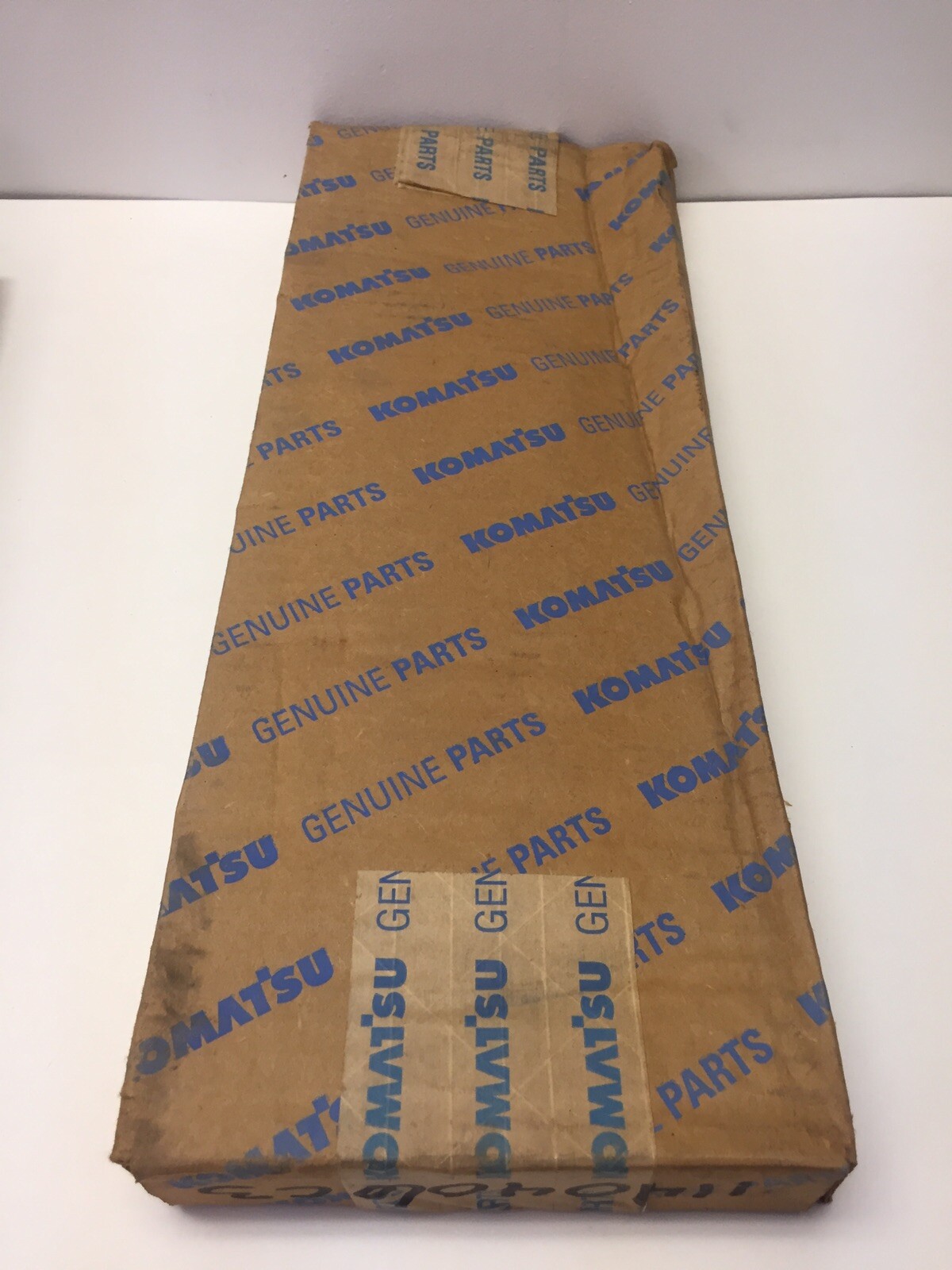 Komatsu Oem Carrier & Lining 1140406C3. Komatsu Nos Brake Pad 