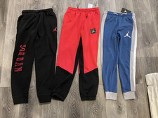 Jordan boys pants 3 pairs; One new w/ tags;Red, blue, black size 10/12 12/13