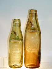 ANTIQUE BOTTLE APRICOT AMBER CODD WITH ROSE SWIRLS GLOBE 12 OZ OLD BOTTLE 1880's