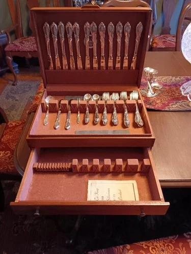 12 place settings of Rhapsody International Sterling silverware