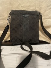 Coach black signature canvas and leather swingpack crossbody bag