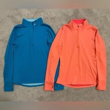Two women s size medium quarter zips, one blue, one coral
