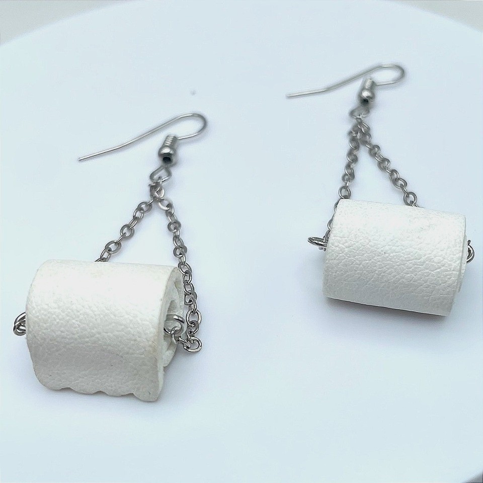 Vintage 90s toilet paper roll dangle earrings in silver tone — the most niche, conversation-stopping jewelry flex imaginable, and they're actually wearable.