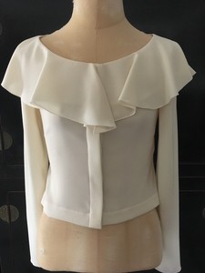 cream ruffle top