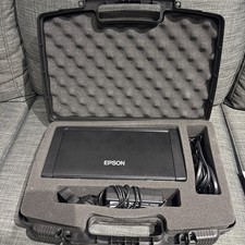 Epson WF-100 Portable Wireless Printer includes: Manual, Power Cord, and CASE