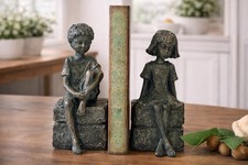 Vintage Style Young Boy And Girl Sitting On B...