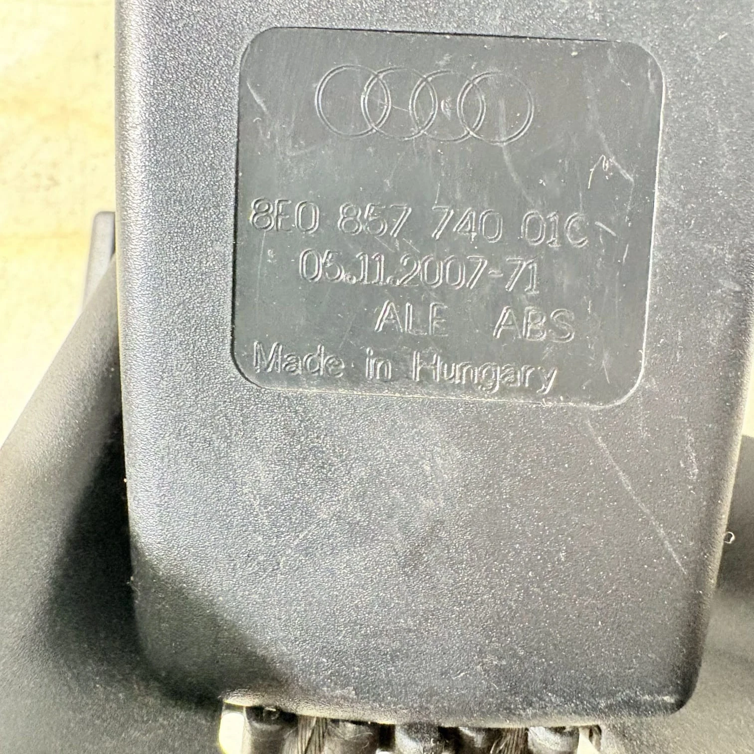 Close-up of Audi part number 8E0 857 740 01C and Made in Hungary marking