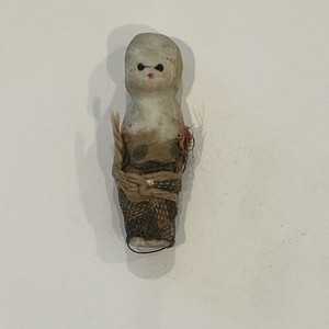 antique miniature all-bisque doll (often colloquially ) called a "Penny Doll"