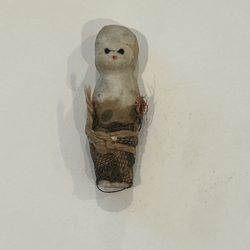 antique miniature all-bisque doll (often colloquially ) called a "Penny Doll"