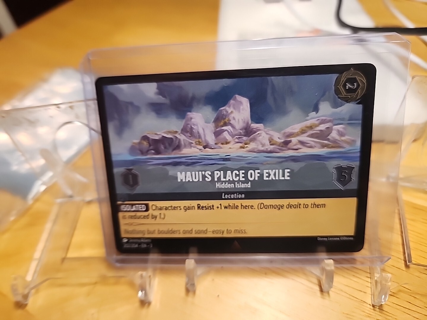 DISNEY LORCANA INTO THE INKLANDS MAUI'S PLACE OF EXILE 202/204 COLD FOIL MINT