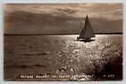 Postcard Ia Clear Lake Iowa Sailboat On Lake Before Sunset Rppc c1950s K35