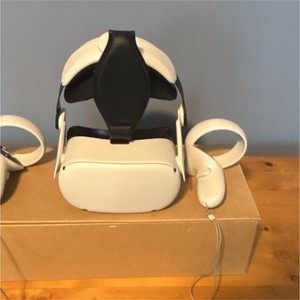 White Meta Quest 2 headset with touch controllers and a MQ5000 VR head strap.