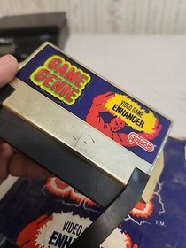 GAME GENIE  Video Game Enhancer  WITH BOOK  NES Nintendo Video Game