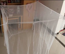 White traditional mosquito net with tie at top block mosquitoes and other pests 