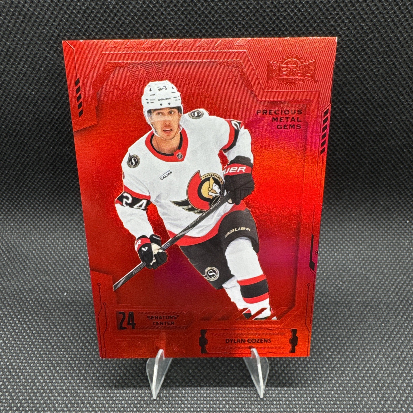 2025-26 SkyBox Metal Universe NHL #67 Dylan Cozens Red PMG /100 Ottawa Senators