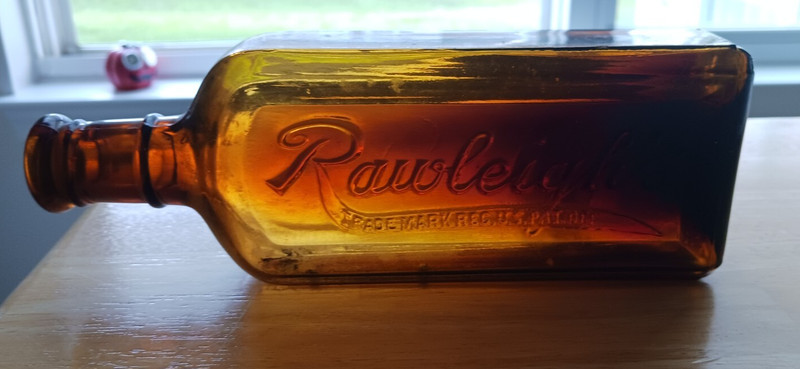 Rawleigh's Cod Liver Oil Embossed Amber Bottle