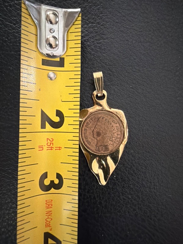 1899 Indian Head Penny set in a Gold Arrowhead Pendant