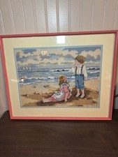 Adorable vintage cross stitch picture frame featuring a boy and a girl