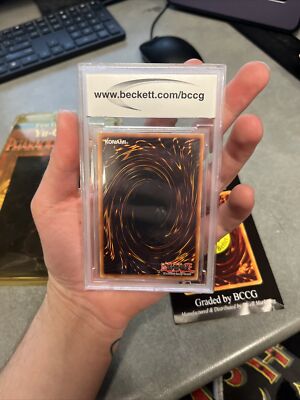 Mystery/unknown graded yugioh card Mint 9 or gem mint 10 graded card..  Unsealed