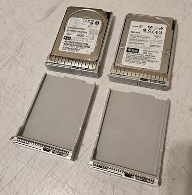 TWO Sun Microsystems Sun Fire T2000 72GB hard drives with caddy + two blank bays
