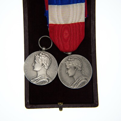 Set of two labour and trade medals given to the same person.