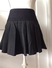 BEBE pleated double lined mini skirt w lace waistband detail