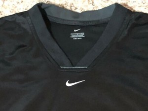nike shirt with swoosh in middle