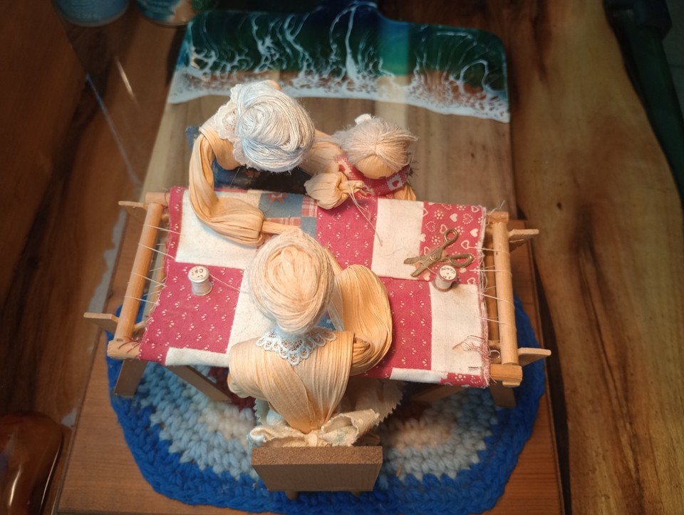 Hand-crafted cornhusk dolls in a music box from a named Arizona artist — genuinely regional American folk art, not factory made.