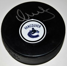 VASILY PODKOLZIN signed (VANCOUVER CANUCKS) autographed hockey puck W/COA