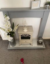 electric fire and surround , hearth used. Brought blue in colour painted it grey