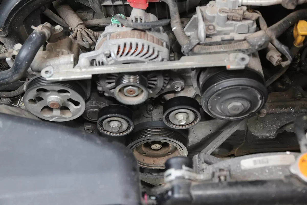 A vehicle's accessory drive with the serpentine drive belt removed.