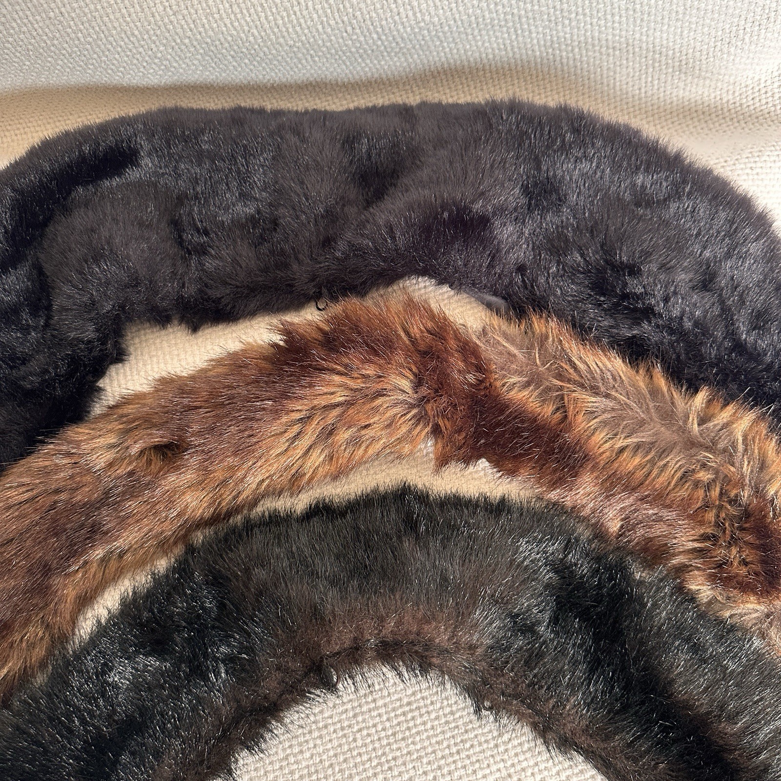 Set of three vintage faux fur collar wraps in brown and black.
