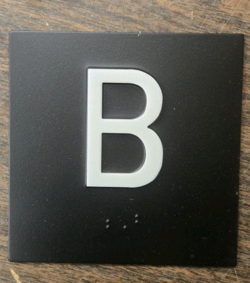B - Elevator Jamb Plate Sign with Braille and Raised (black, white 4x4)