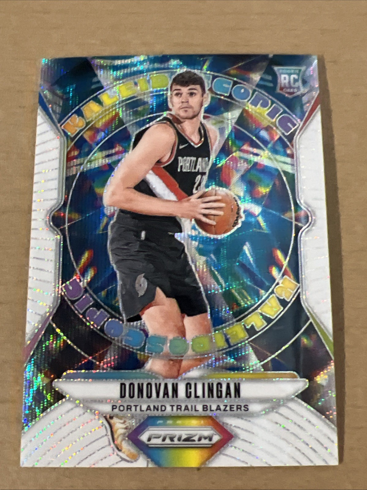 2024-25 Panini Prizm Donovan Clingan Kaleidoscopic White Wave Prizm #01 /20 RC