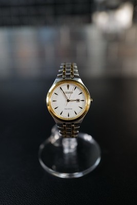 Citizen Eco Drive E011 R008129 Women s Two Tone Date Watch White Dial Gold Tone