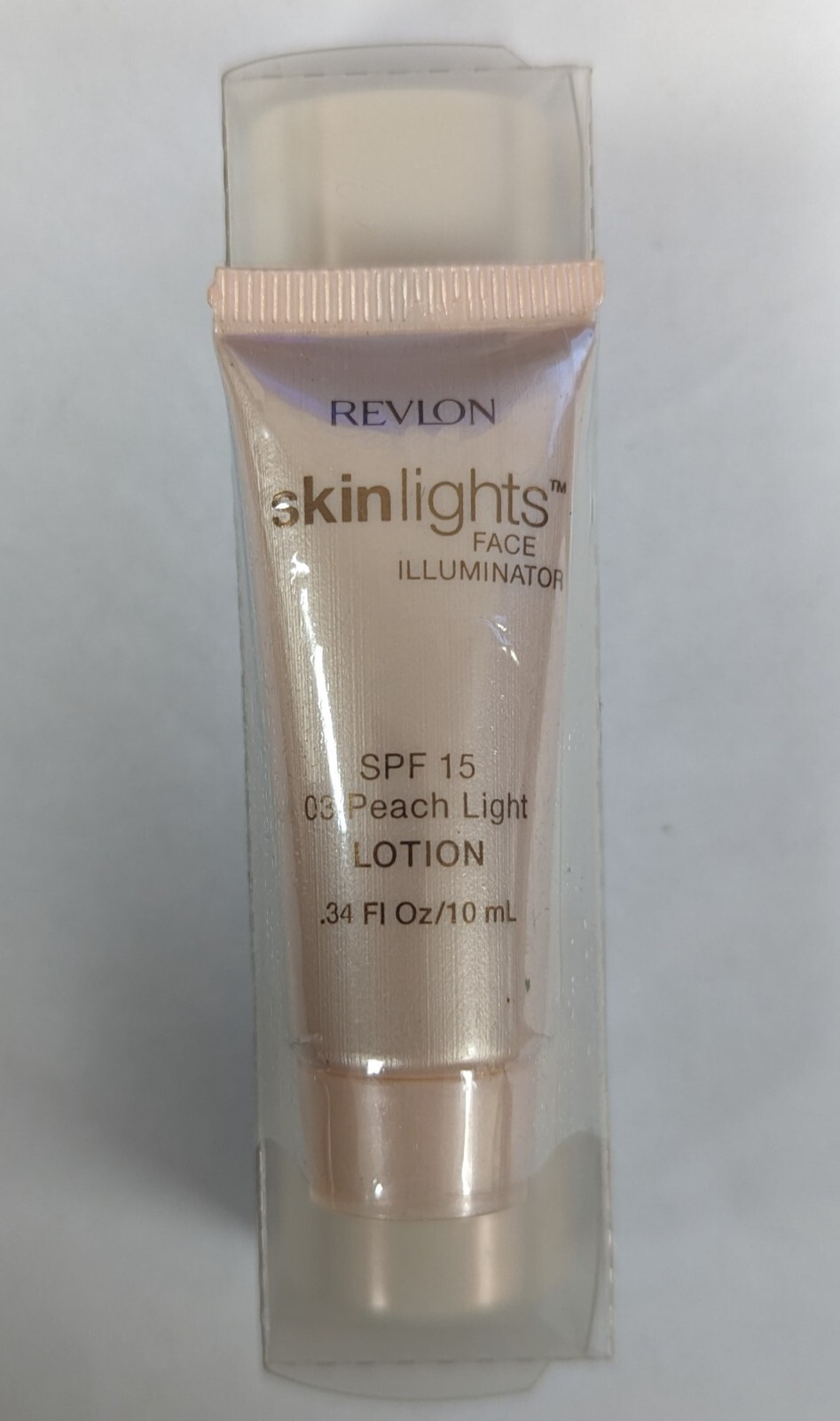 REVLON SKINLIGHTS FACE ILLUMINATOR STICK 01 NAT. LIGHT 0.4OZ W/ 03 PEACH LOTION