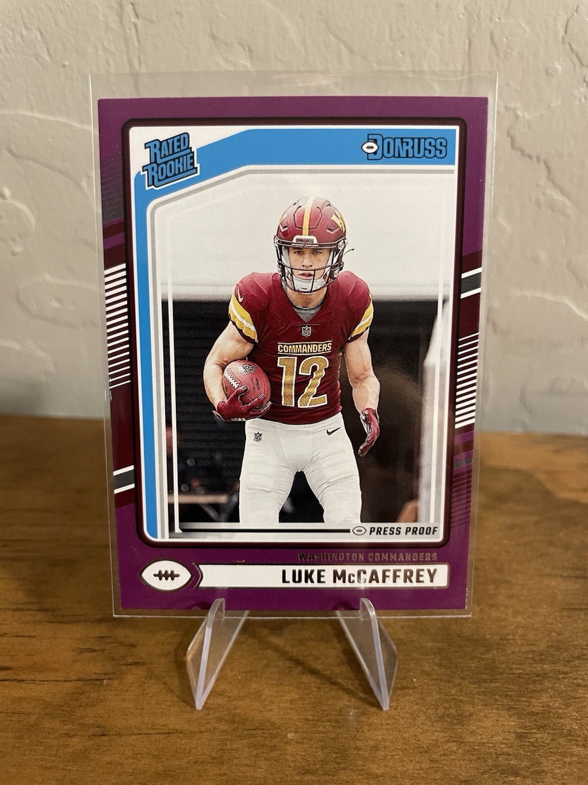 Luke McCaffrey 2024 Panini Donruss #302 Rated Rookie Press Proof Purple RC