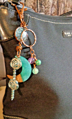 Artisan crafted, 6 1/2  long bag charm, detachable key ring. Crushed apatite in
