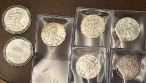 Lot of #7 Uncirculated Silver Eagles $1. Winner gets all seven coins. ￼