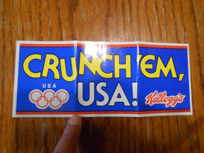 1984 Olympics 8.5 by 3.5'' Kellogg's CRUNCH EM USA  Bumper Sticker - NEW