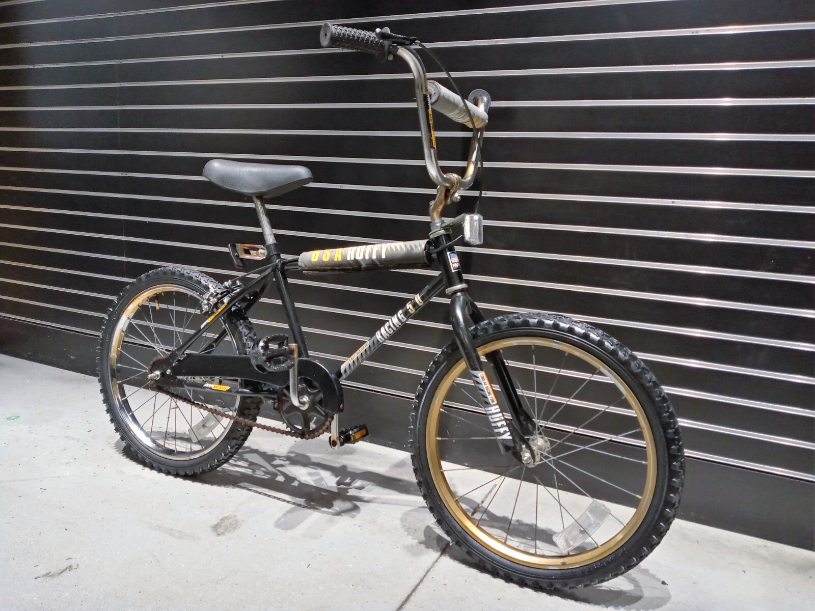 black and gold huffy bike