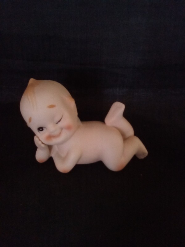 Vintage Porcelain Kewpie Winking Laying Down Figurine  3" X 4" kw913