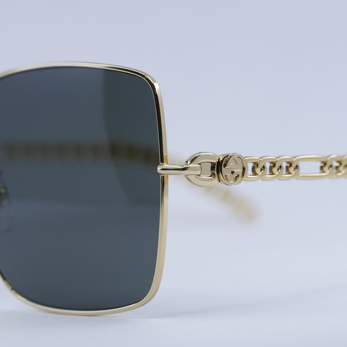 GUCCI GG0724S 001 Gold with Black GG Logo on Gold Chain/Grey