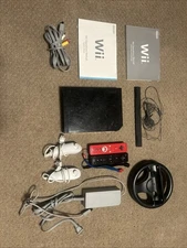 Nintendo Wii, 2 Controllers Nunchucks Manuals Sensor Bar AC Adapter And AV Cable